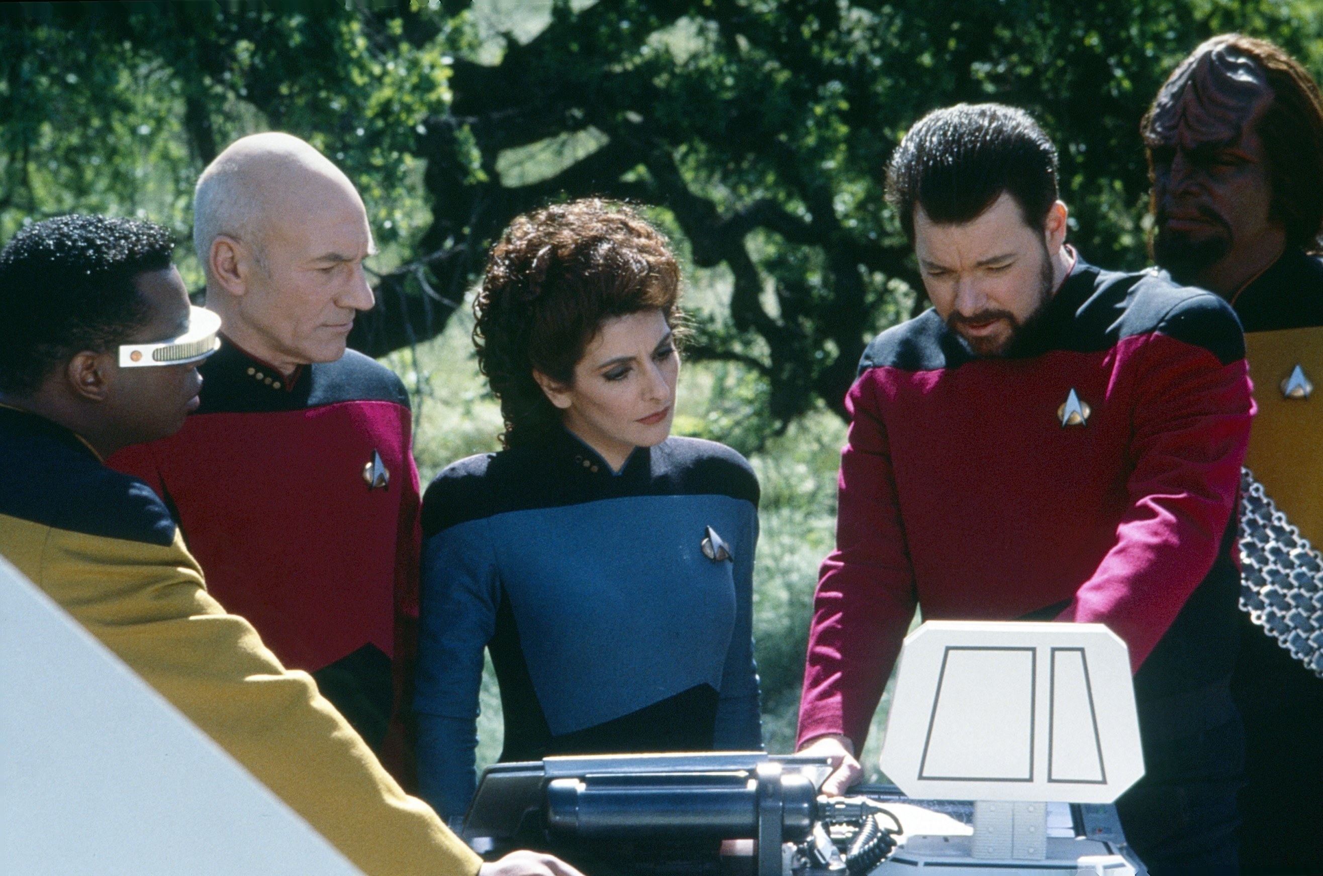 the cast of &quot;Star Trek: The Next Generation&quot; looking at something