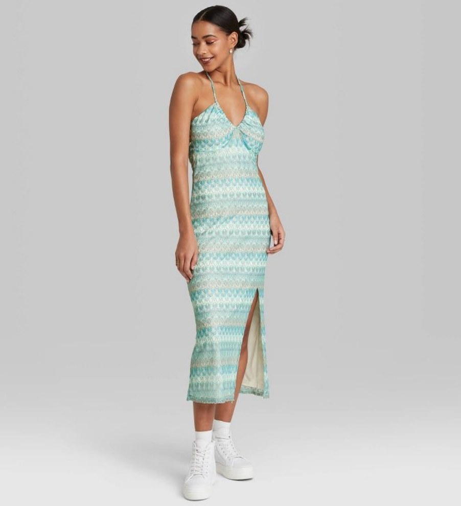 A model wearing a aqua blue crotchet slip dress