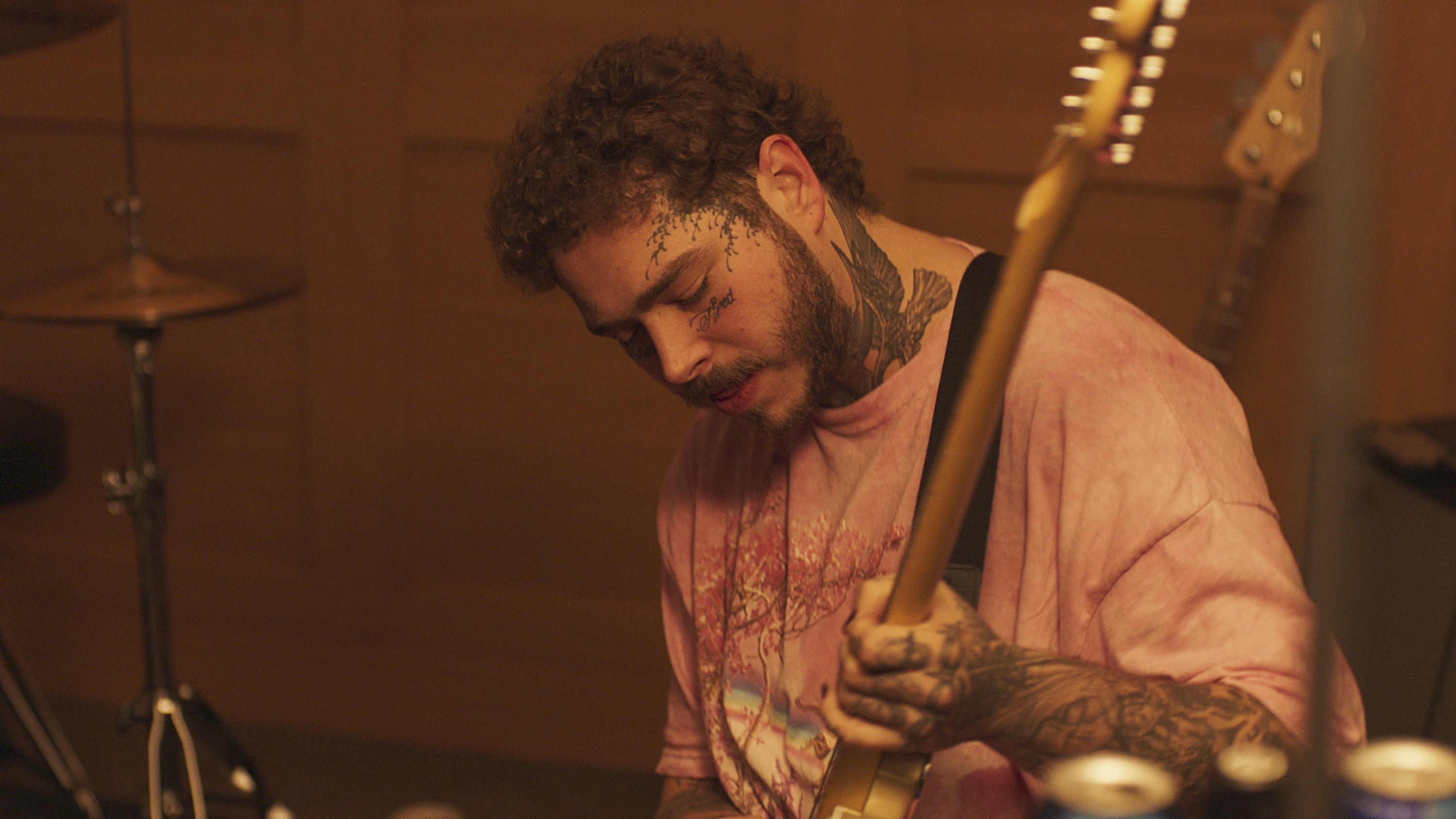 Post Malone plays the guitar