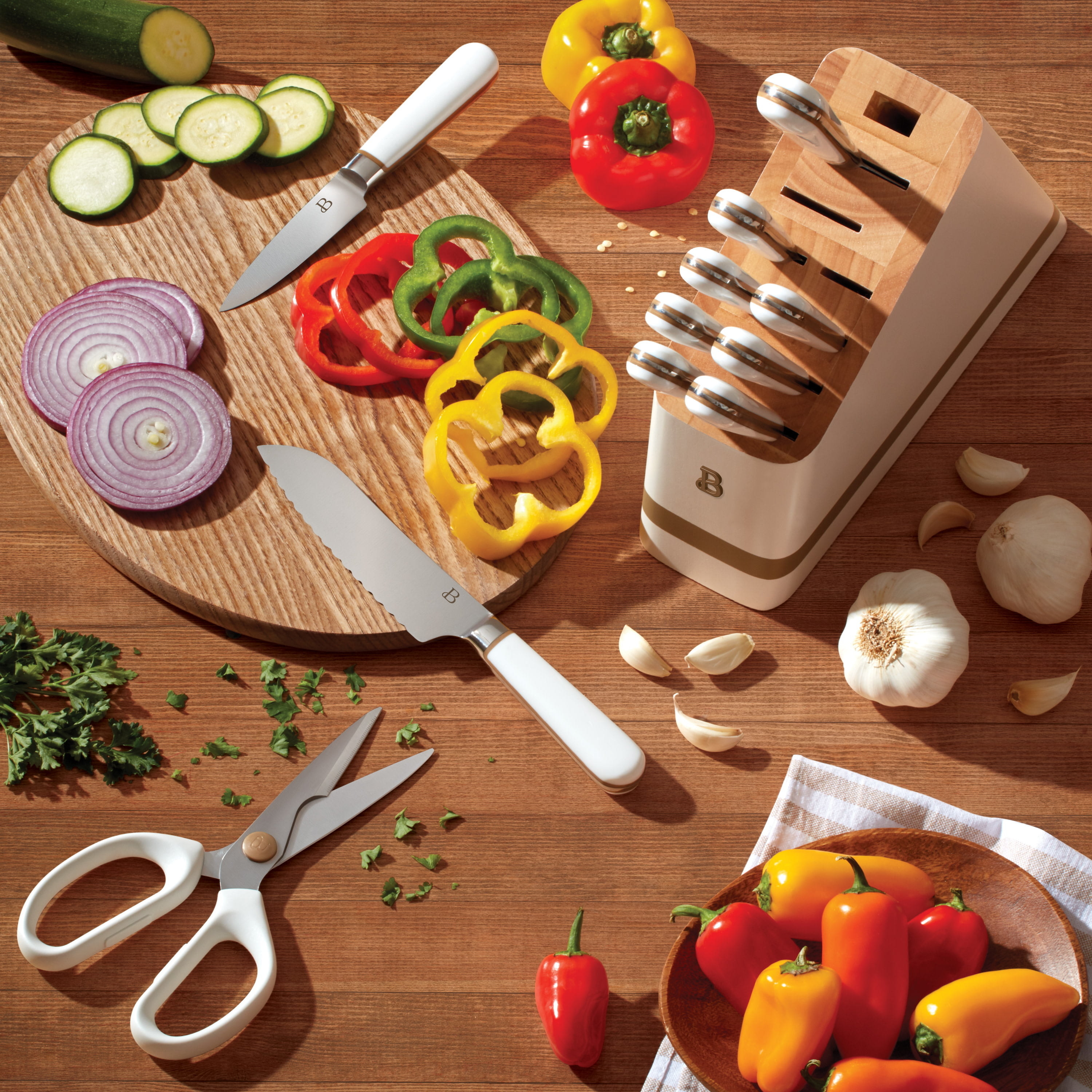 the knife block on a table with vegetables