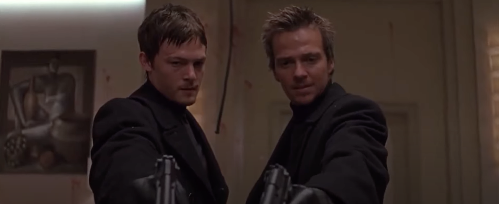 Boondock Saints brothers hold guns while praying