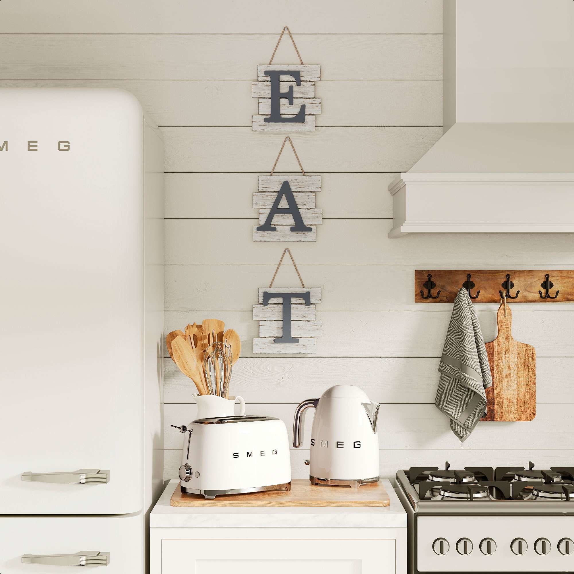 the eat sign hanging in a kitchen
