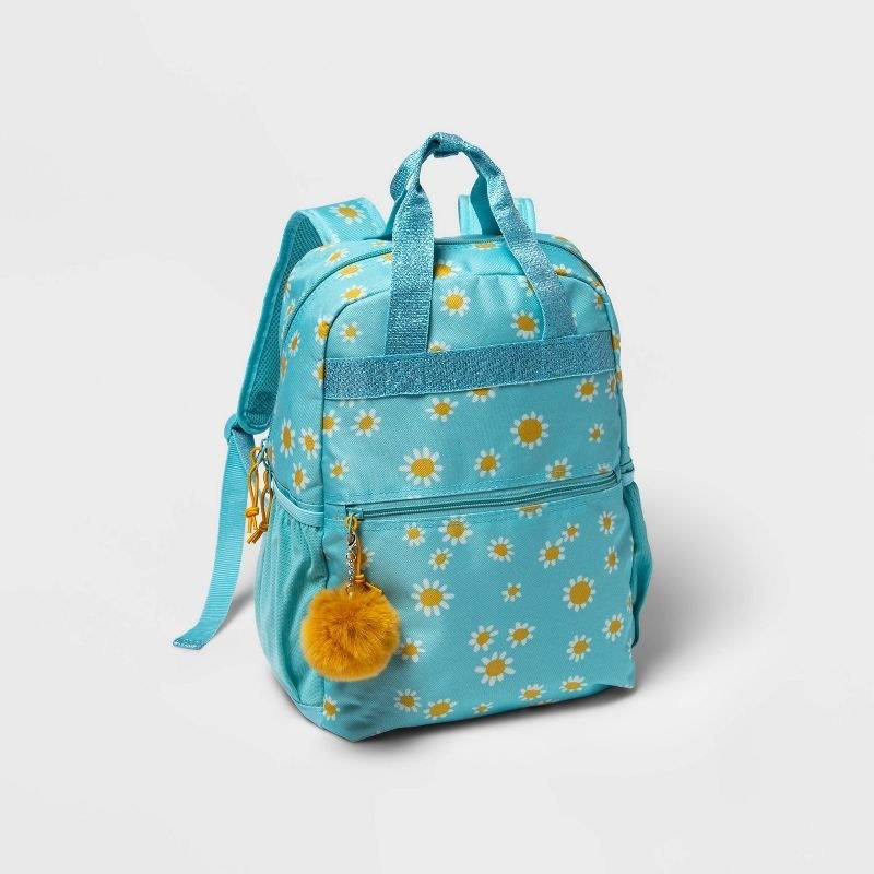 Blue backpack with daisies