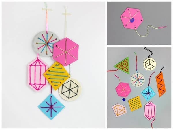 Sewing cards with different line decorations and hanging from strings