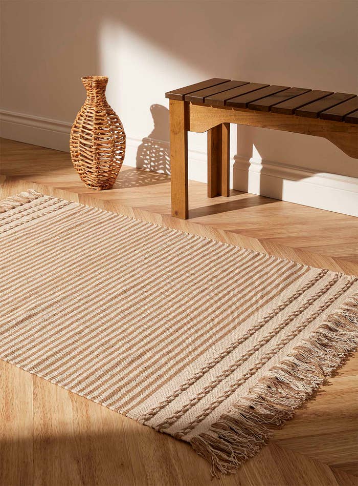 a cozy rug on a wood floor