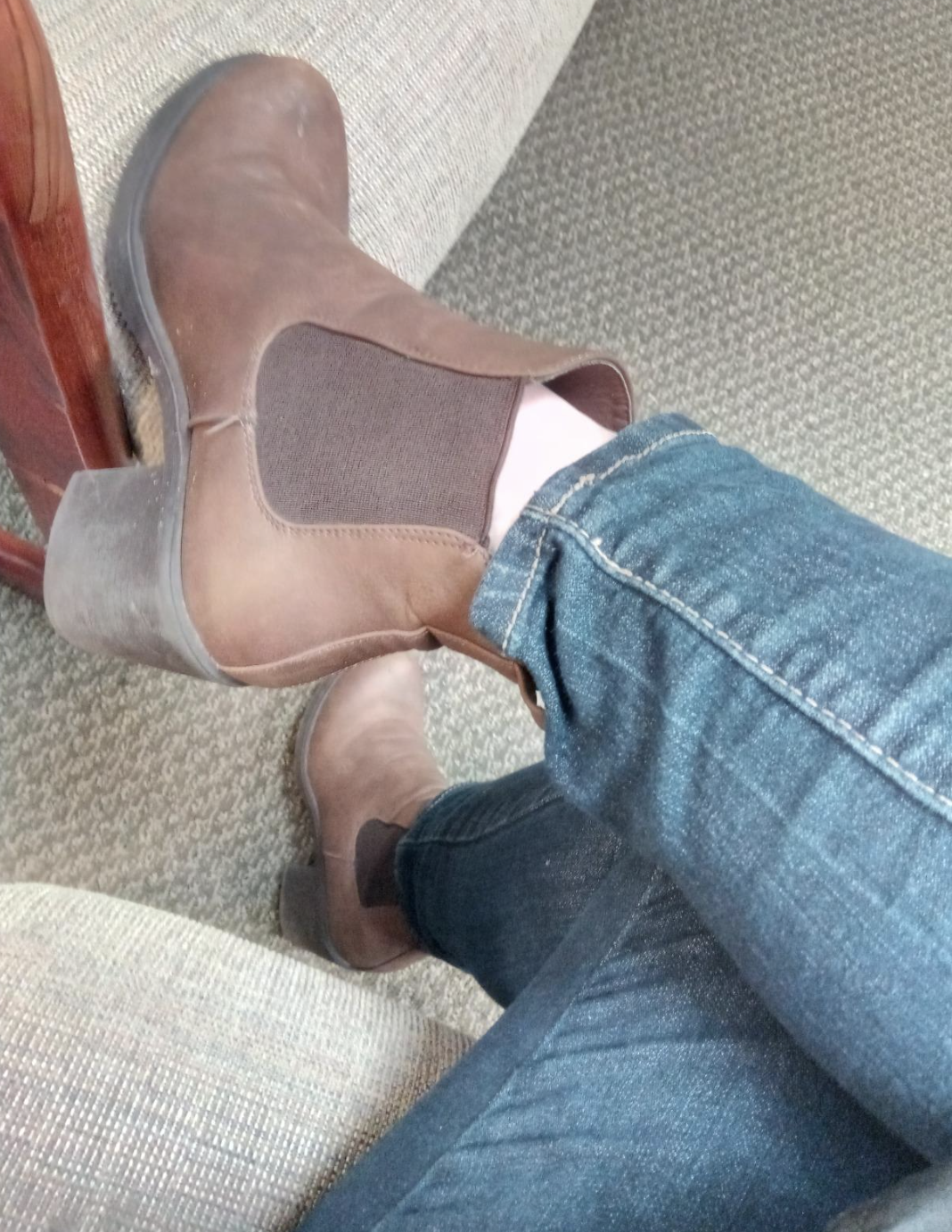 reviewer wearing the brown chelsea boots