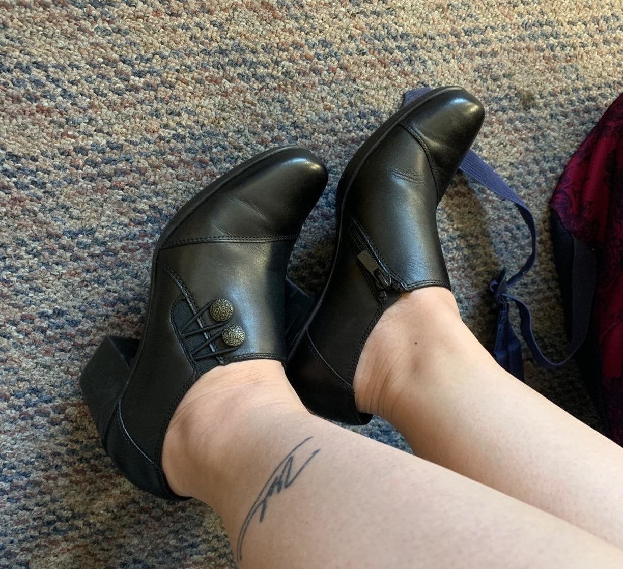 Reviewer in the black Clarks