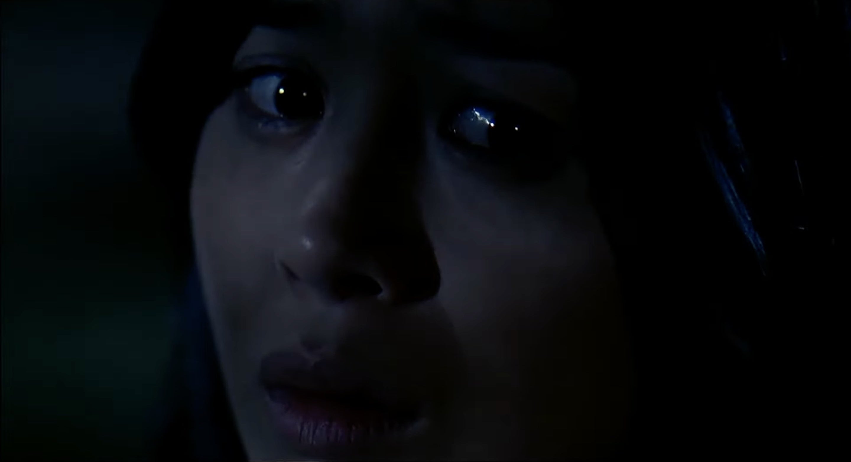 Close-up of scared-looking woman