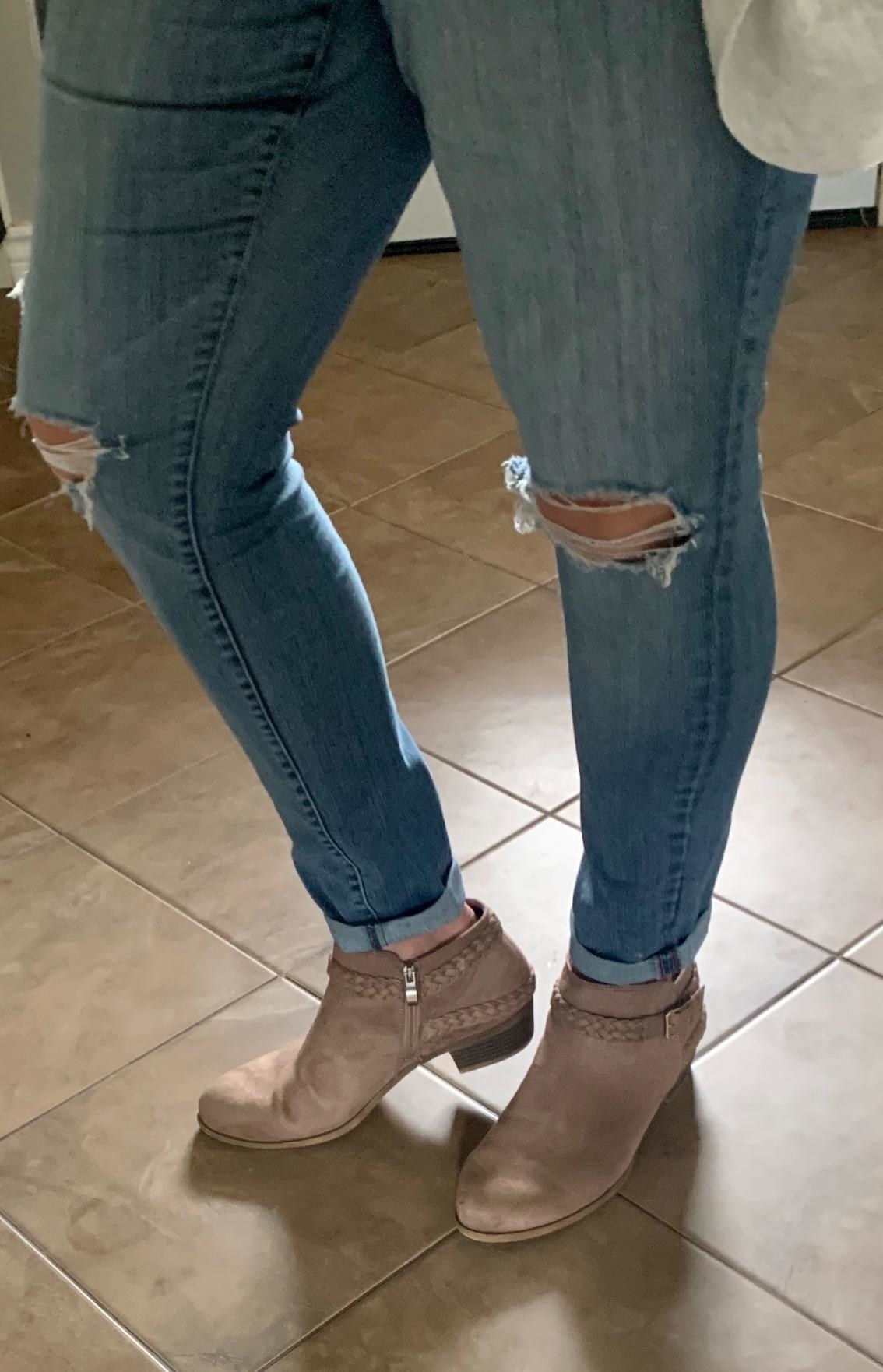 Reviewer in the light tan booties with jeans