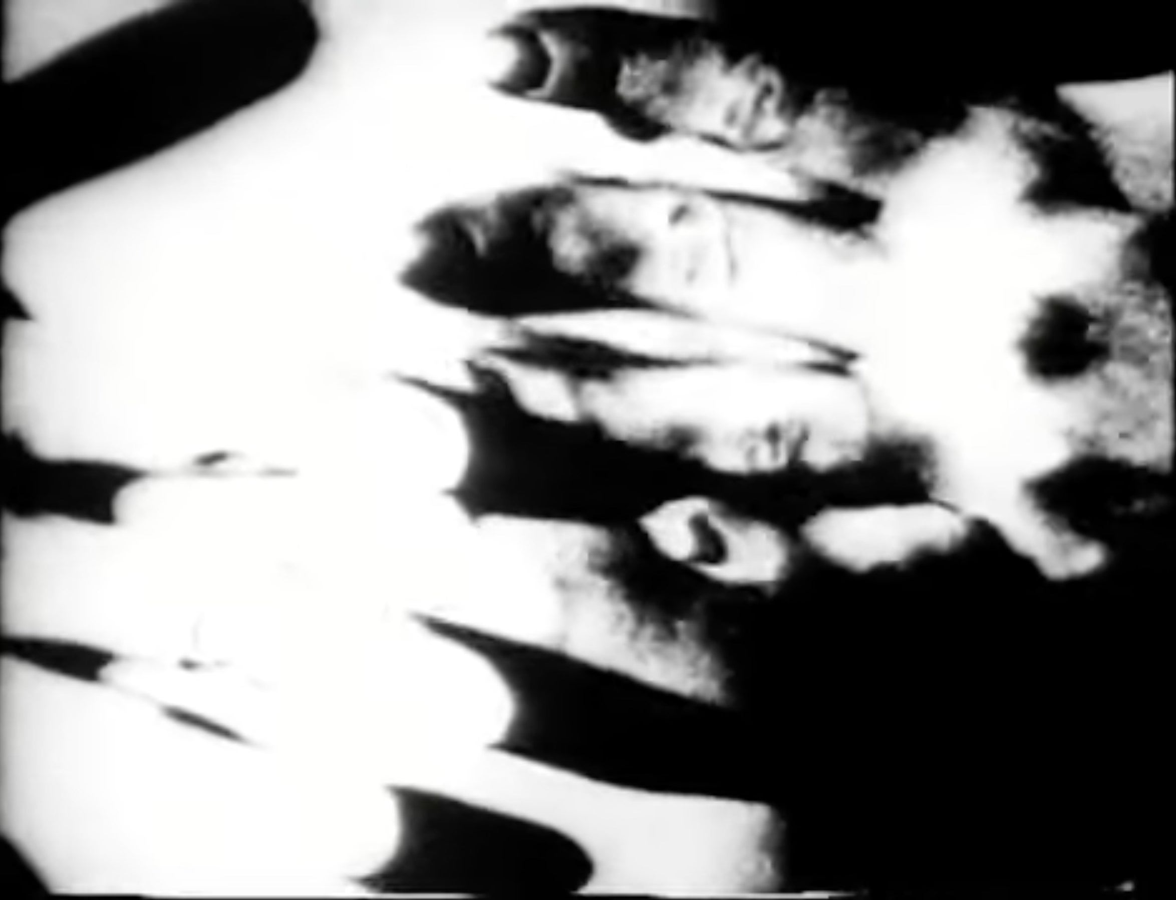 Blurry black-and-white image of a hand