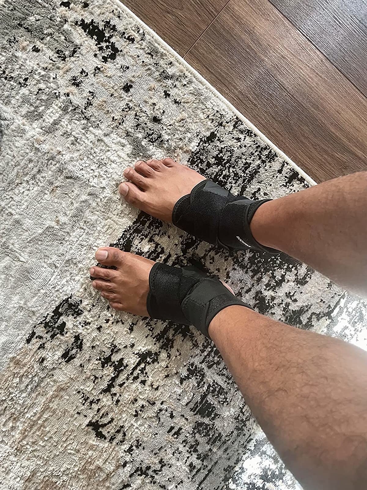 A reviewer wearing a foot an ankle support brace