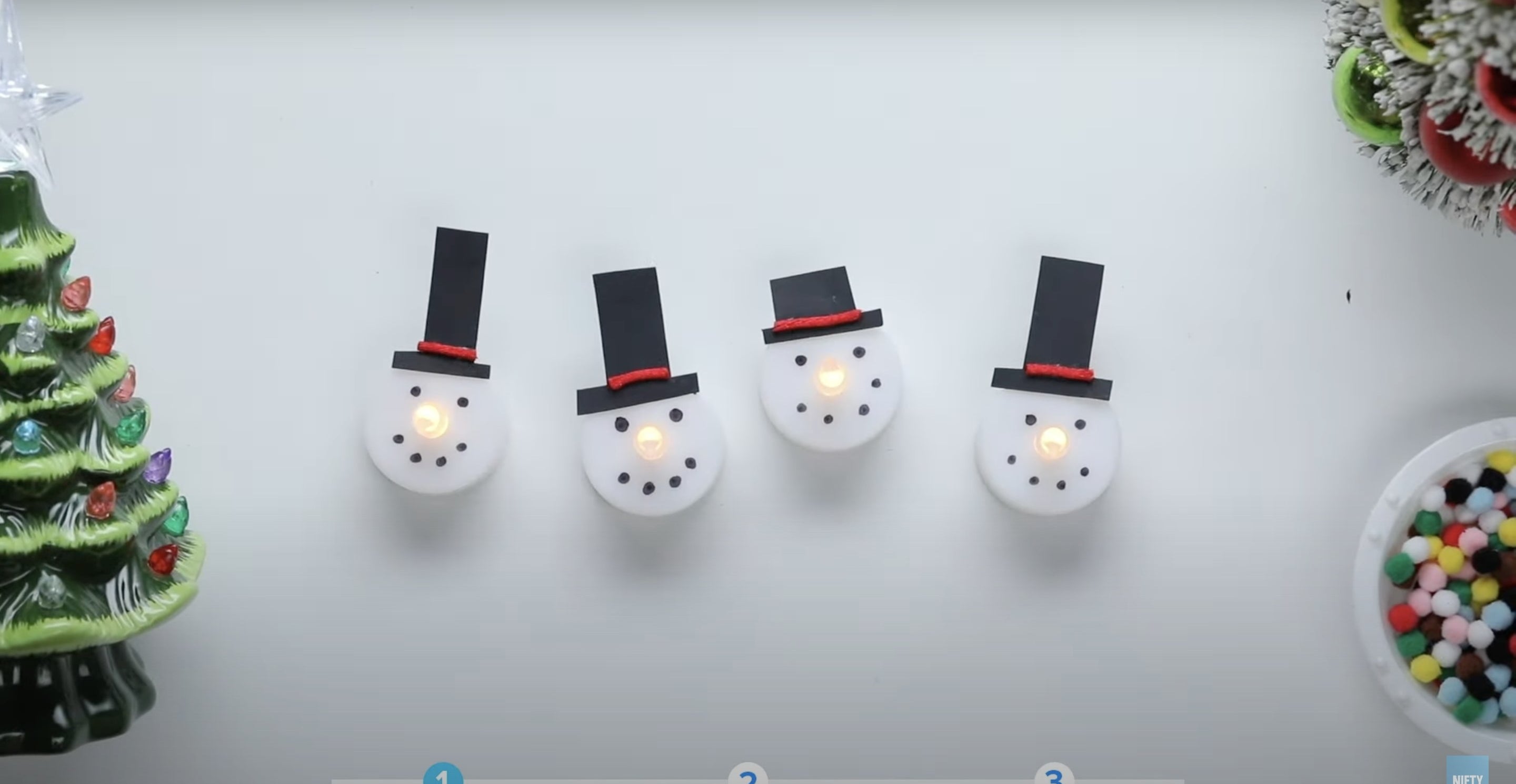 Snowman face figures with hats