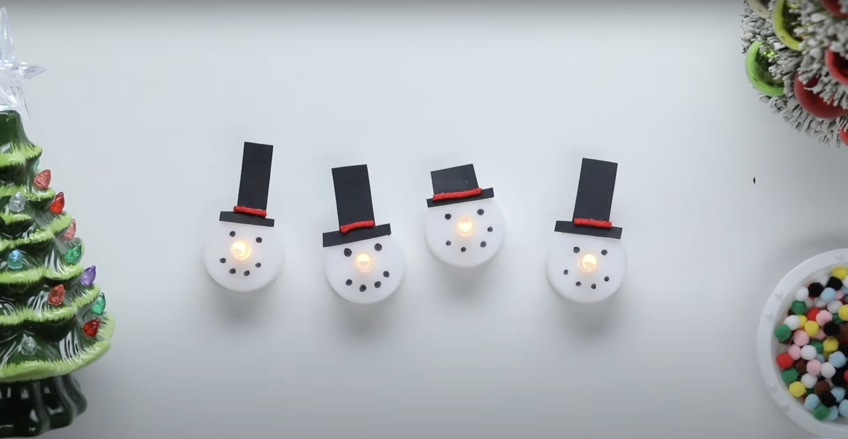 Snowman face figures with hats