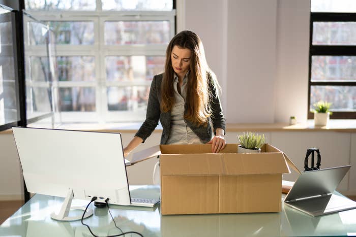 woman packing up her desk