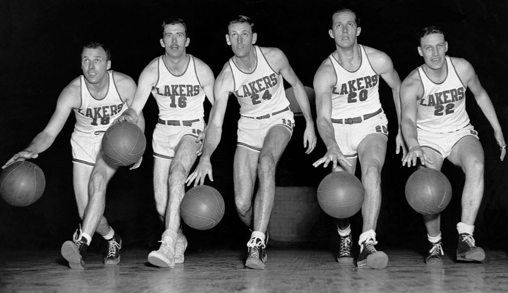 old photo of some Lakers players practicing in their uniforms