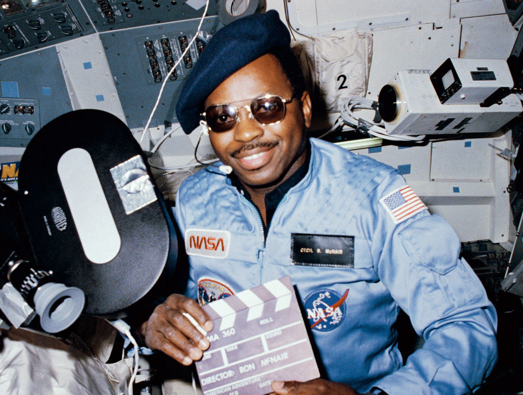 Ronald posing in a NASA space uniform