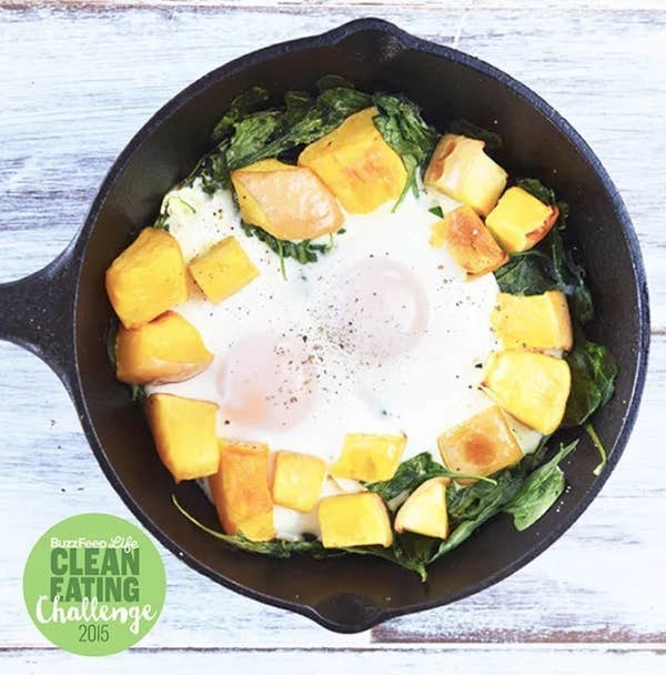 Baked Eggs in Butternut Squash and Spinach cooking in a pan