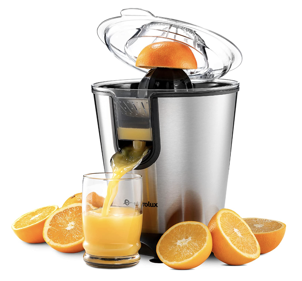 the silver citrus juicer making fresh orange juice from oranges