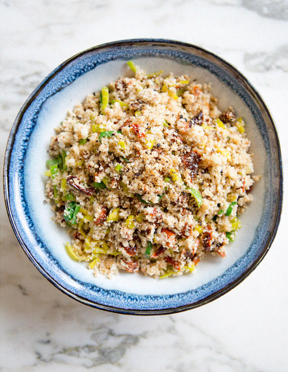 Cauliflower &quot;Couscous&quot; With Leeks and Sundried Tomatoes on a plate