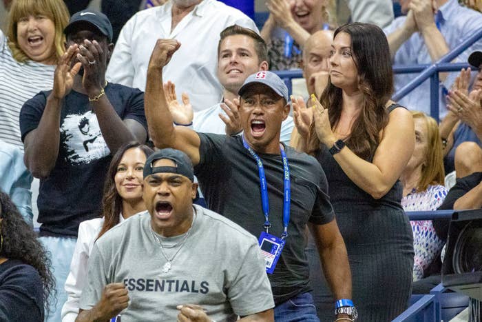 Tiger Woods excitedly fist pumping in the stands during Serena&#x27;s match