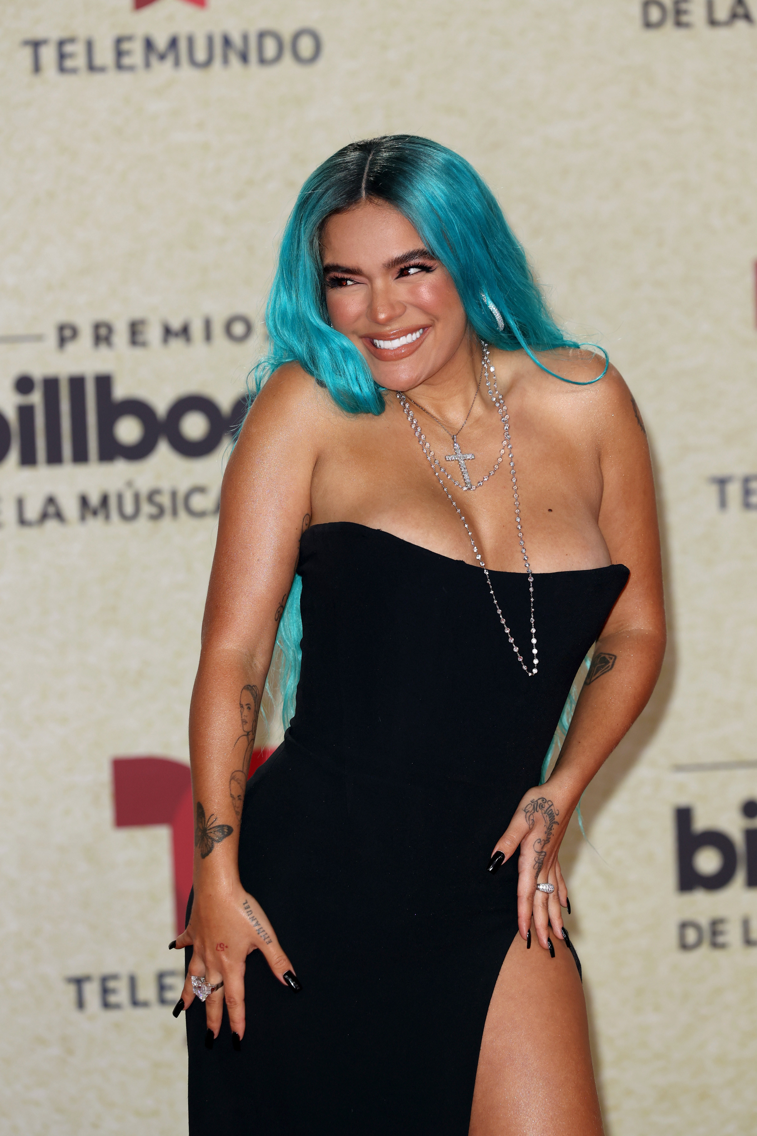 Karol G smiles at the 2021 Billboard Latin Music Awards