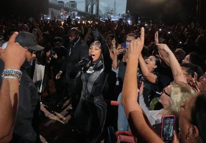 Alicia Keys walking through concert audience