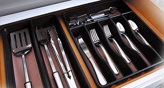 The cutlery tray in a drawer filled with utensils