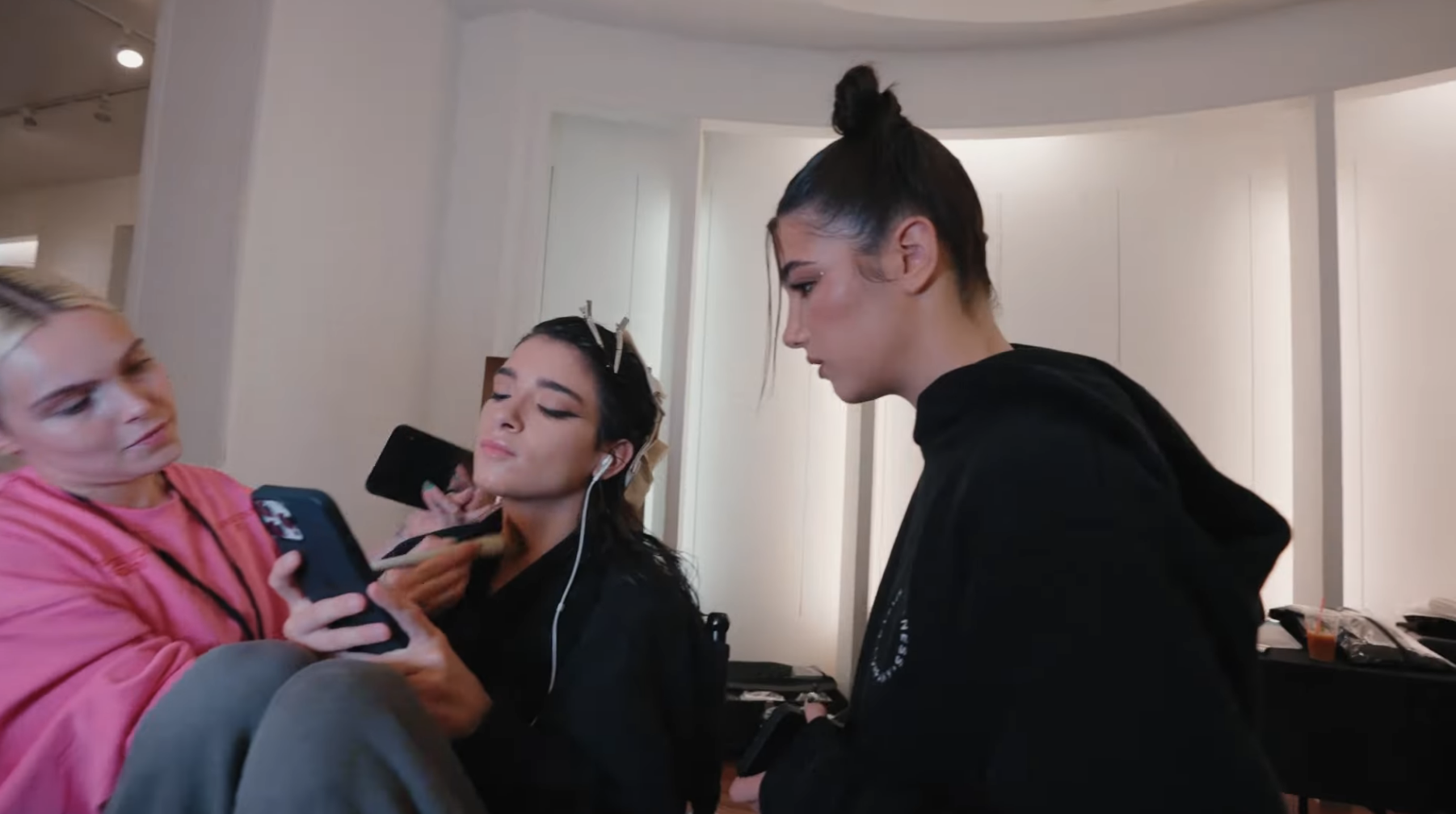 dixie getting her makeup done with charli next to her