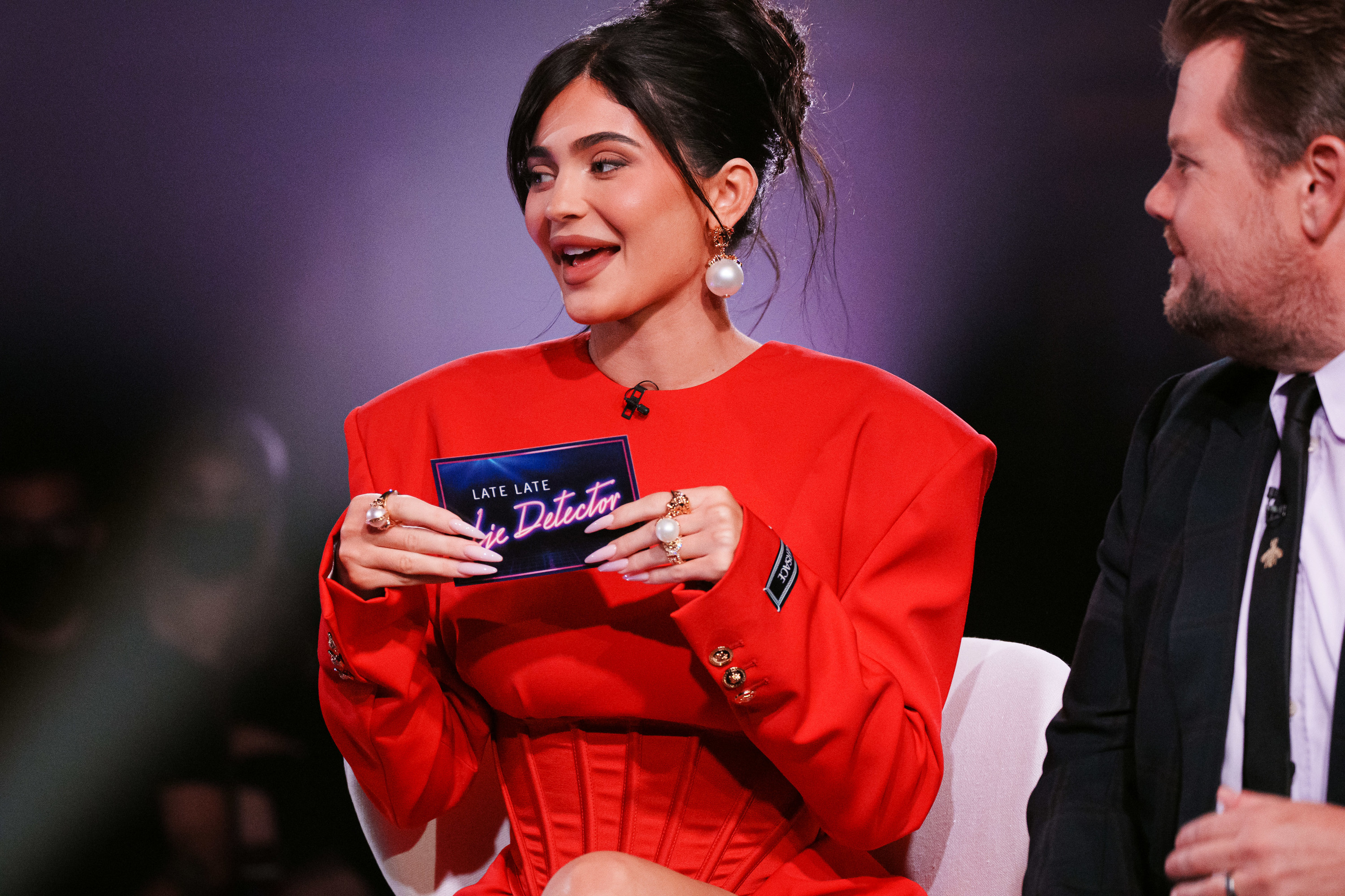 close up of kylie holding an interview card on the show