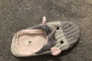 A grey unicorn slipper