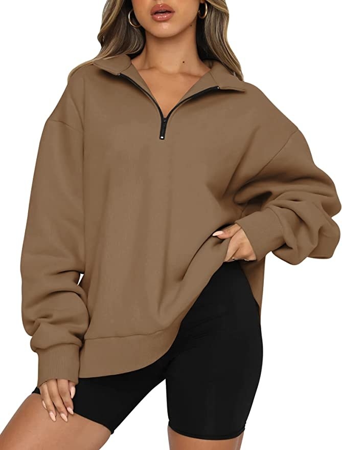 model wearing the tan colored sweatshirt