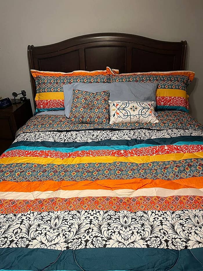 Reviewer&#x27;s photo of the boho bedding on bed