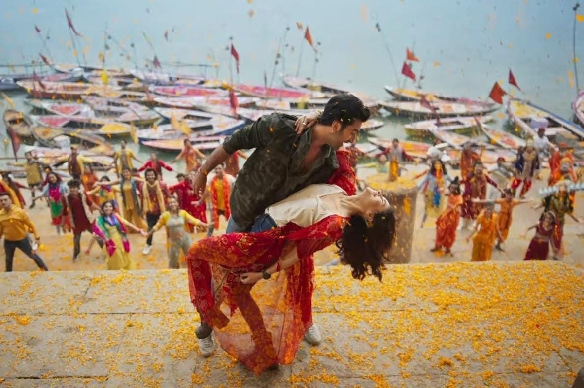 Ranbir Kapoor and Alia Bhatt dancing on the steps of a ghat