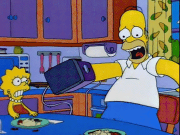 Homer Simpson with his hand stuck in the toaster