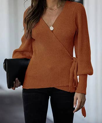 model wearing the sweater in orange