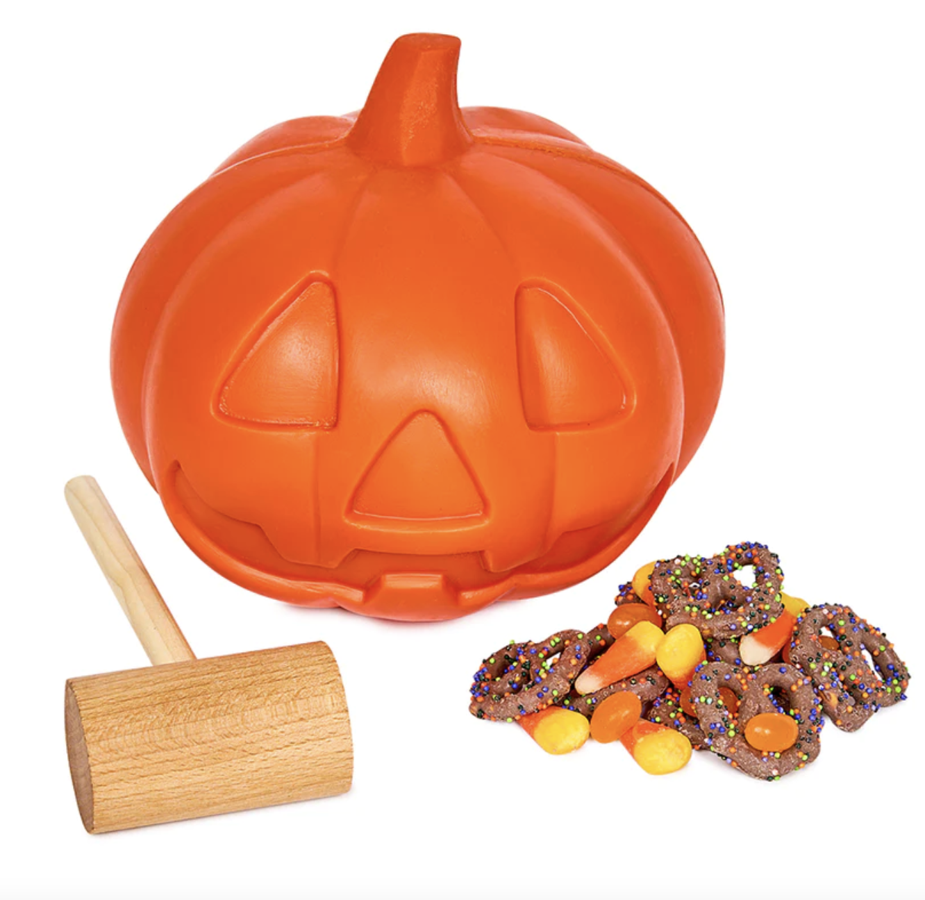 smash pumpkin next to chocolate covered pretzels and candy corn