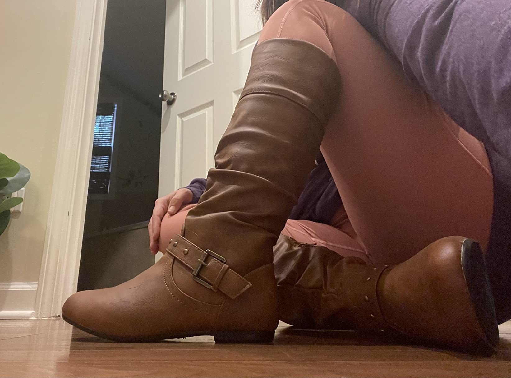 reviewer wearing the brown boots