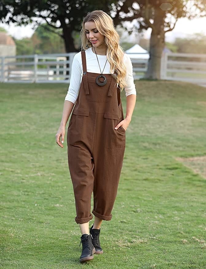 a person wearing the overalls while walking on a field