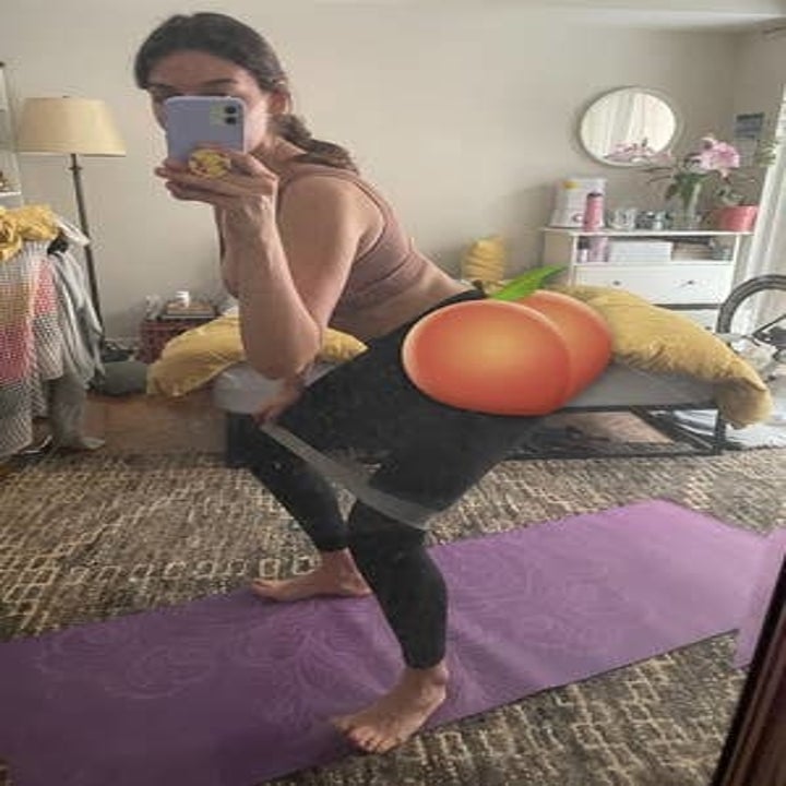 brittany squatting in front of a mirror