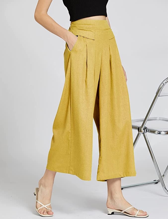 Model in the yellow pants with hand in pocket