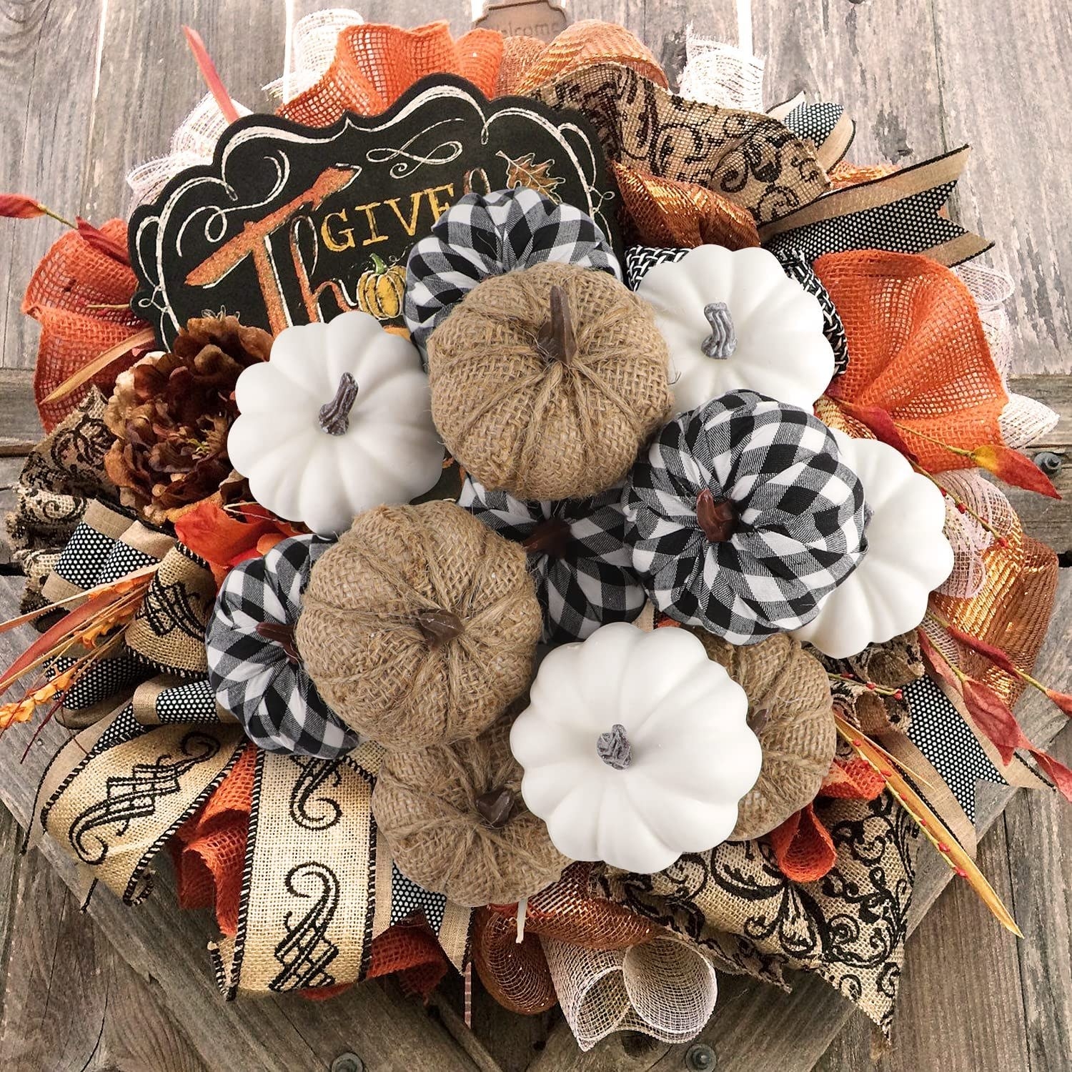 a set of decorative faux gourds arranged on a tabletop