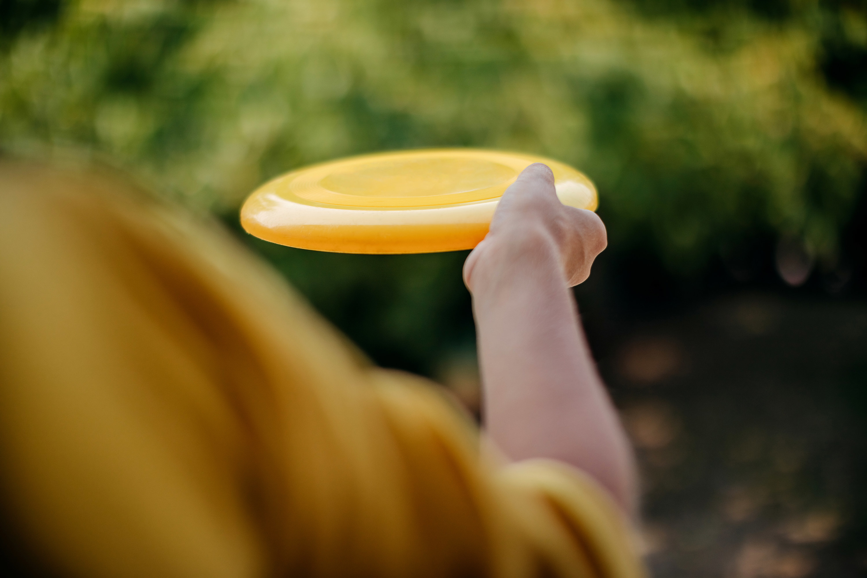 a person holding a frisbee