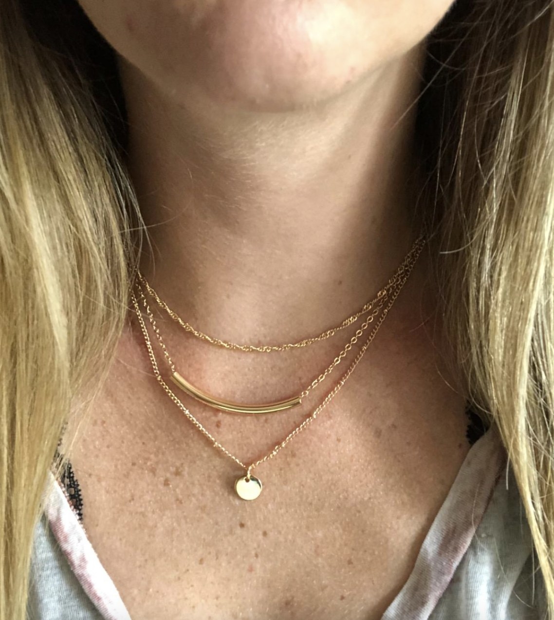 reviewer wearing the layered necklace