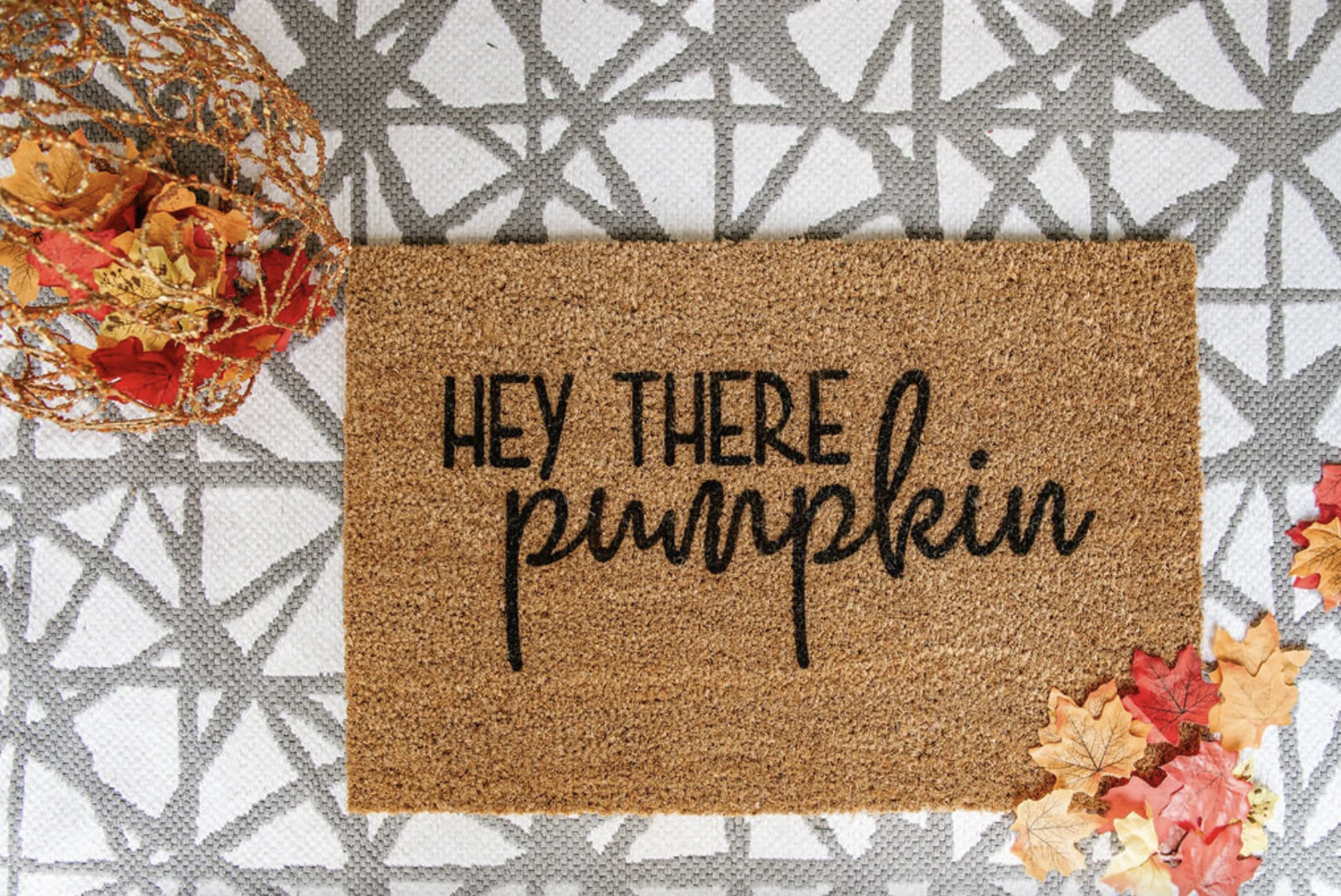 a coir doormat with the words hey there pumpkin on the front