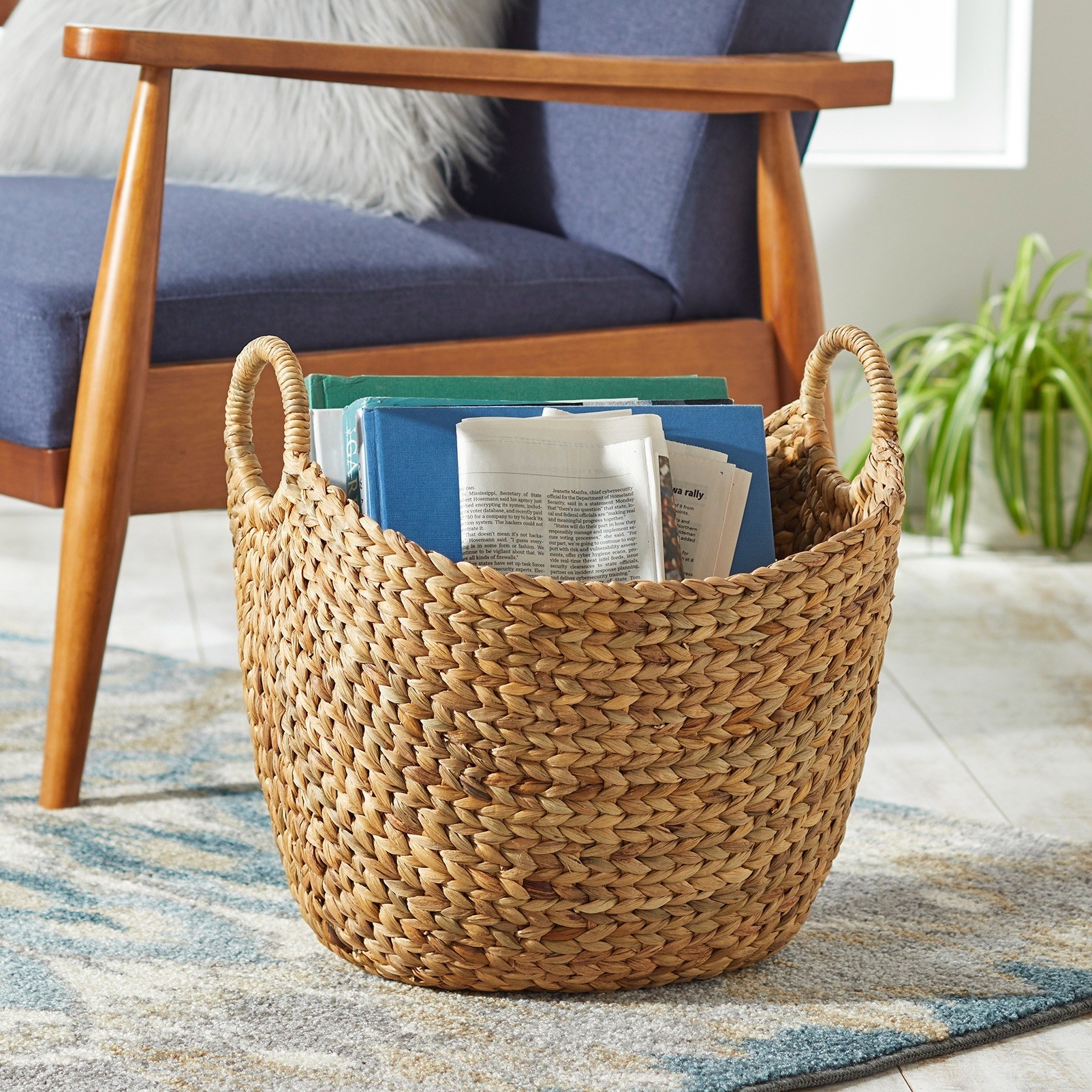 the basket with books and newspapers in it