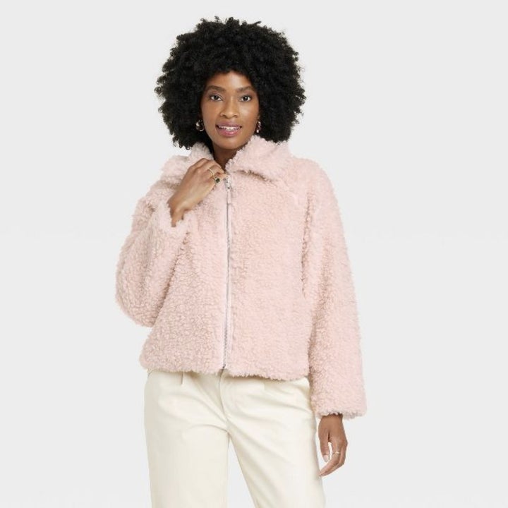The model wears the light pink option