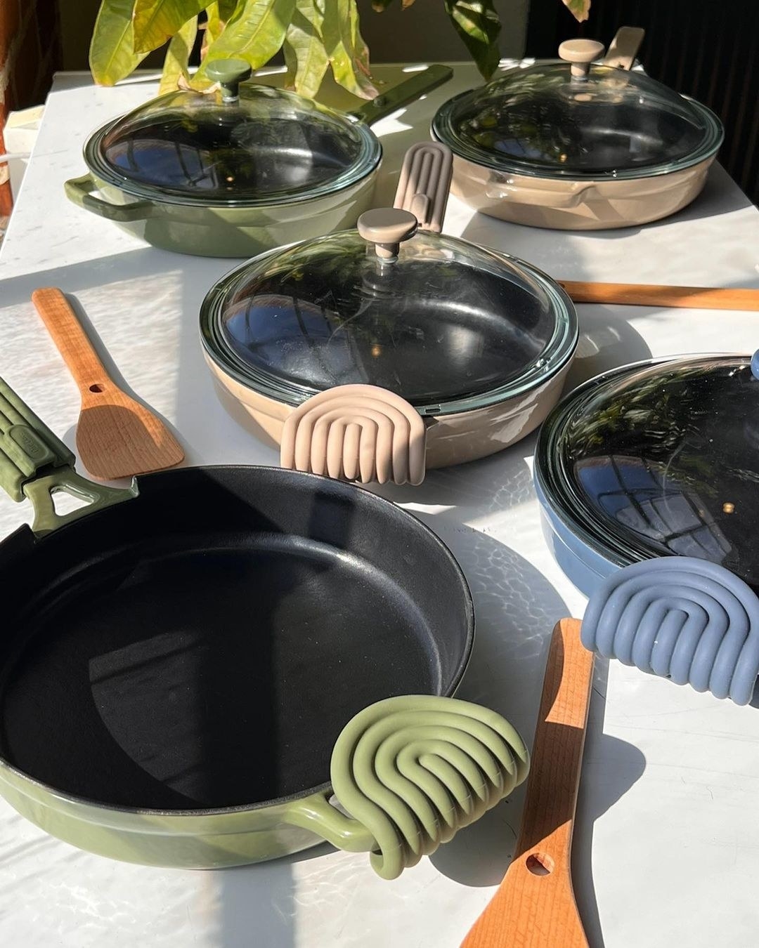 Several cast iron pans on a table