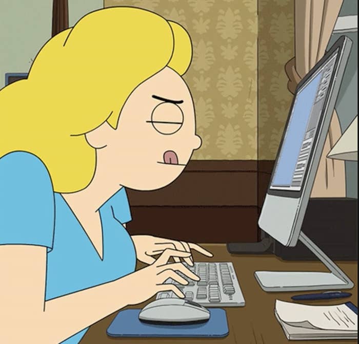 an animated blonde woman typing on a computer