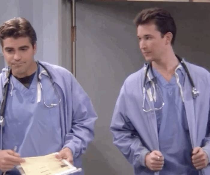 two male nurses standing next to each other
