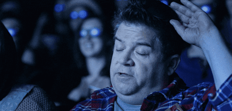 Patton Oswalt putting on glasses in a movie theater and saying that the film will suck